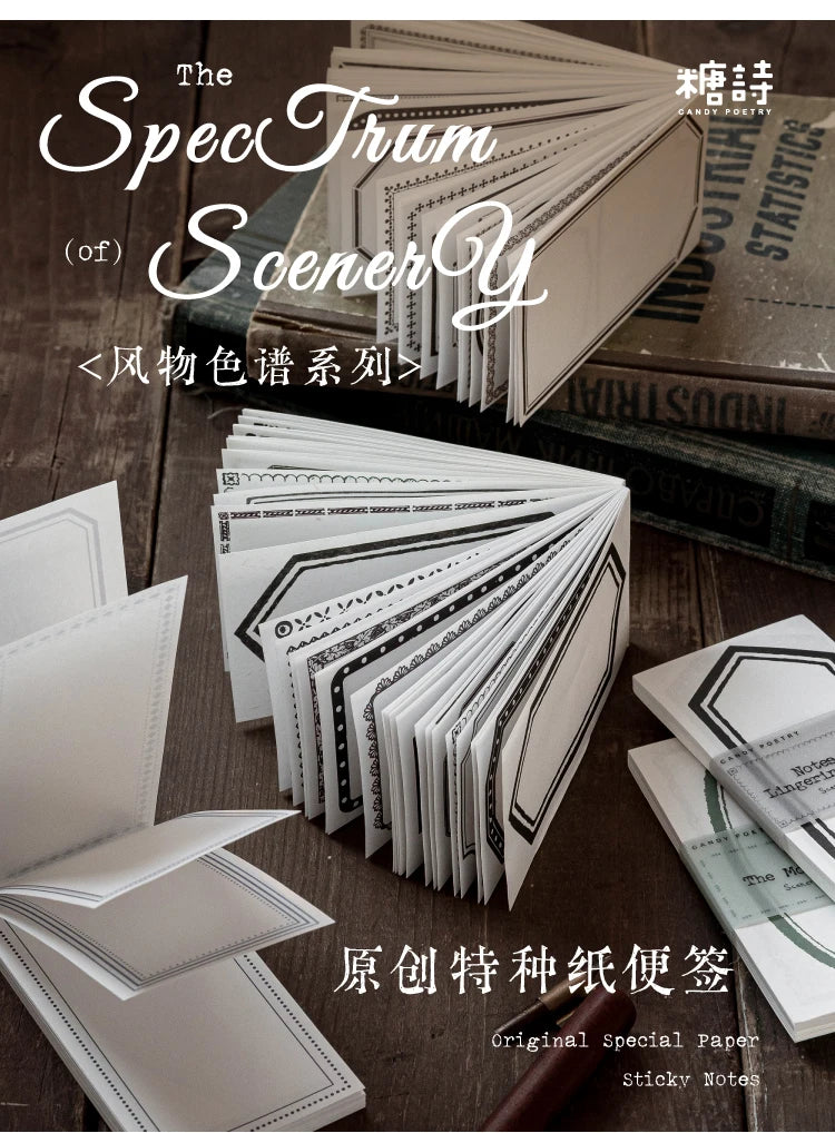 A stack of special paper and sticky notes for journaling and crafts displayed on a wooden surface.