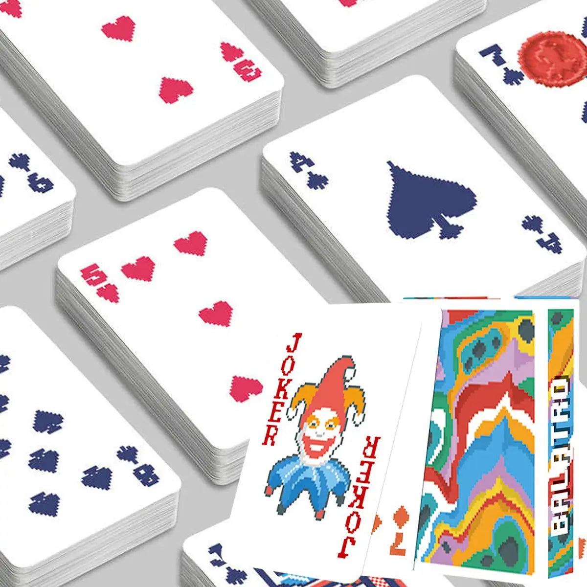 A stack of classic joker poker playing cards showing various face cards and suits.