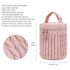 A pink insulated baby bottle bag with a quilted texture and zipper, designed for organizing bottles.