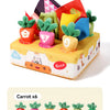 A yellow box containing six soft pulling carrot sensory toys with numbered stems for babies
