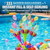 A close-up of water balloons being thrown into a swimming pool, with many colorful balloons floating in the water.