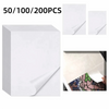 Stack of white double-sided diamond painting release paper sheets and individual sheets.