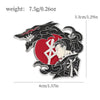 A black and red enamel lapel pin featuring a stylized fierce beast head and a face with spiky hair.