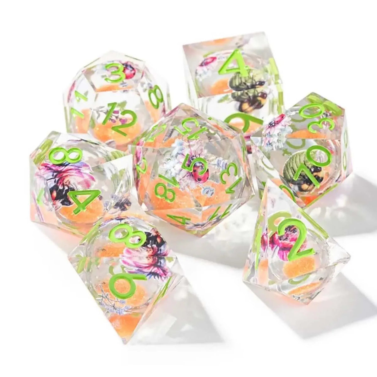 A set of seven pink floral butterfly resin polyhedral dice for tabletop role-playing games