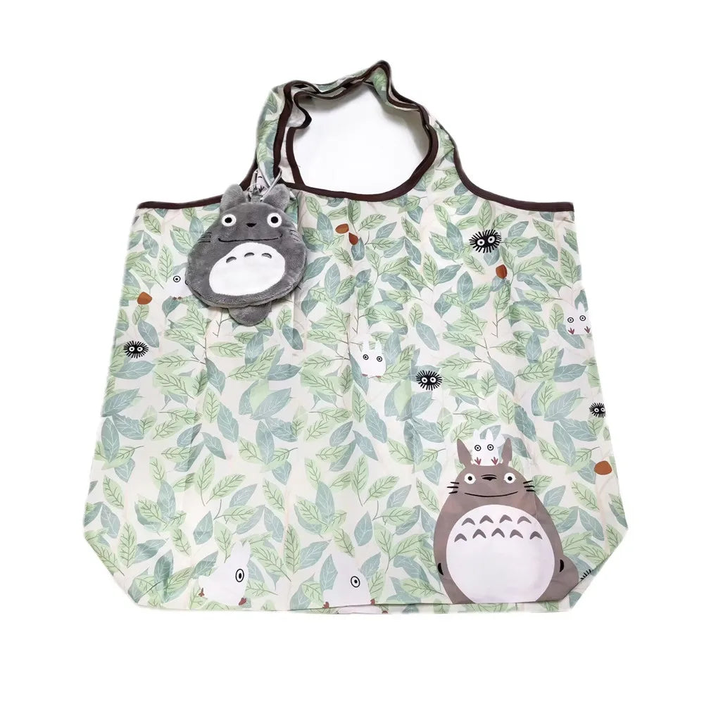 A light green patterned fabric tote bag featuring cute cartoon hippo and owl designs.