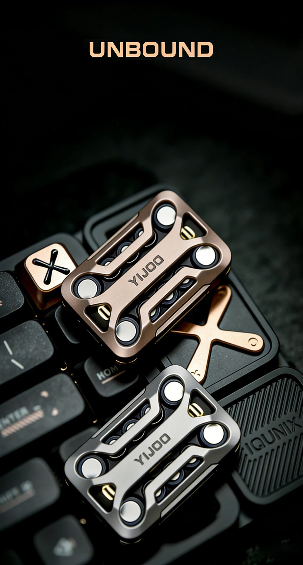 A close-up of a bronze metal magnetic fidget slider placed on a black electronic device.