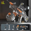 An automatic electric UMP45 water blaster rifle with a clear barrel and orange accents, shown in a studio setting.