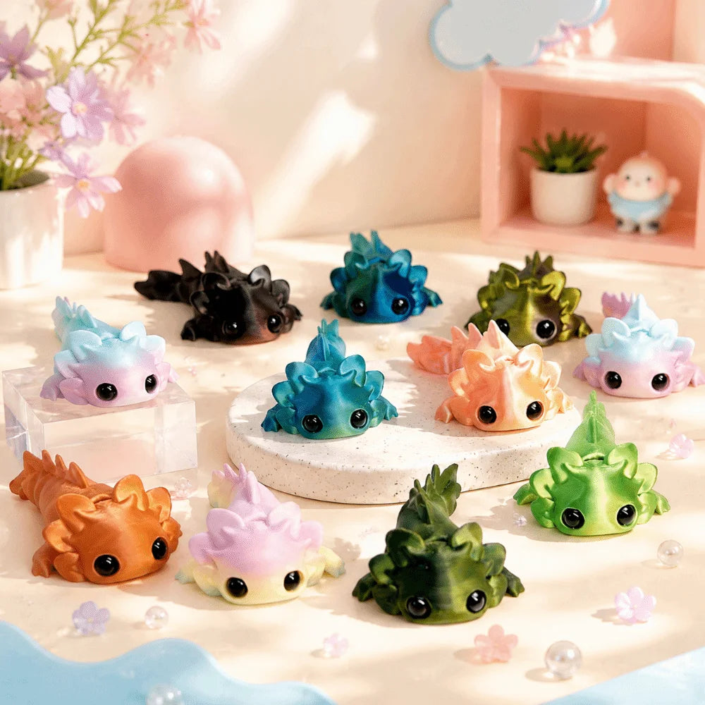 A set of eight colorful flexible salamander figurines in various shades of blue, green, and orange displayed on a light surfa