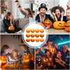 A group of people interacting with squishy ghost and pumpkin fidget toys for stress relief