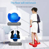 A child is using a red bouncing ball trainer for balance and coordination on a tiled floor.