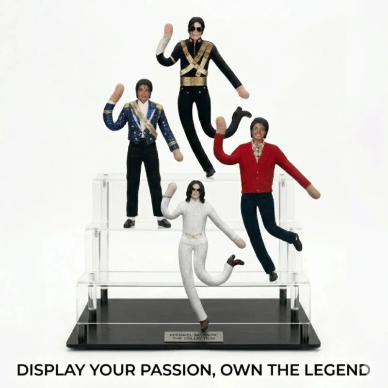 A display of three Michael Jackson collectible plush dolls in various outfits and poses.