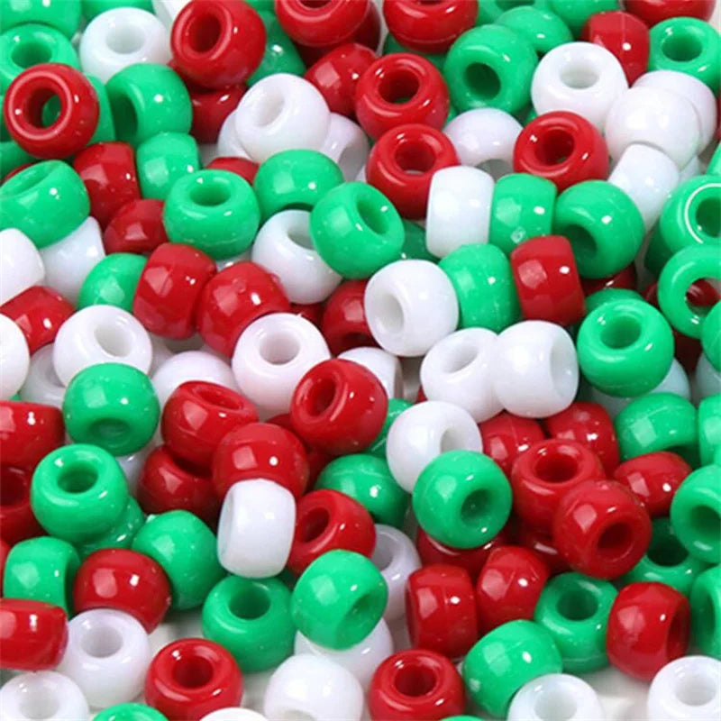 A close-up view of a large pack of rainbow pony beads in various colors including red, green, and white.