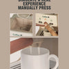A close-up of a coffee machine set being manually pressed, showing the process and resulting coffee in a mug.