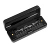 Black harmonica with a stainless steel cover showing numbered holes and decorative script