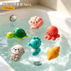 Six plastic bath toys shaped like a sea turtle, clam, and other animals floating in water.