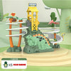 A green dinosaur race track set featuring climbing stairs, a yellow tower, and various terrain elements.