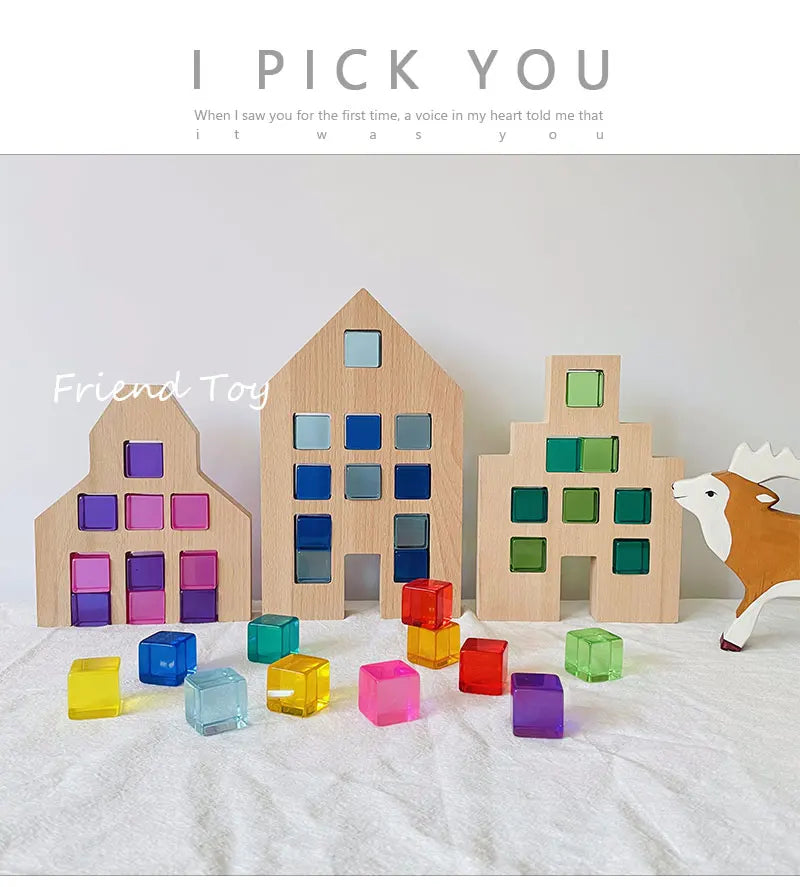 A collection of colorful acrylic building blocks in various shades of purple, blue, green, and yellow arranged on a white sur