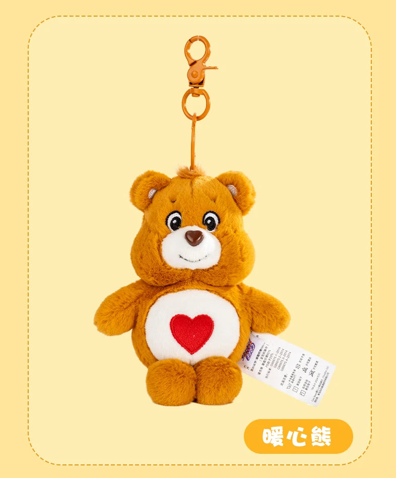 A fluffy orange Care Bears plush toy attached to a gold-colored keychain ring.