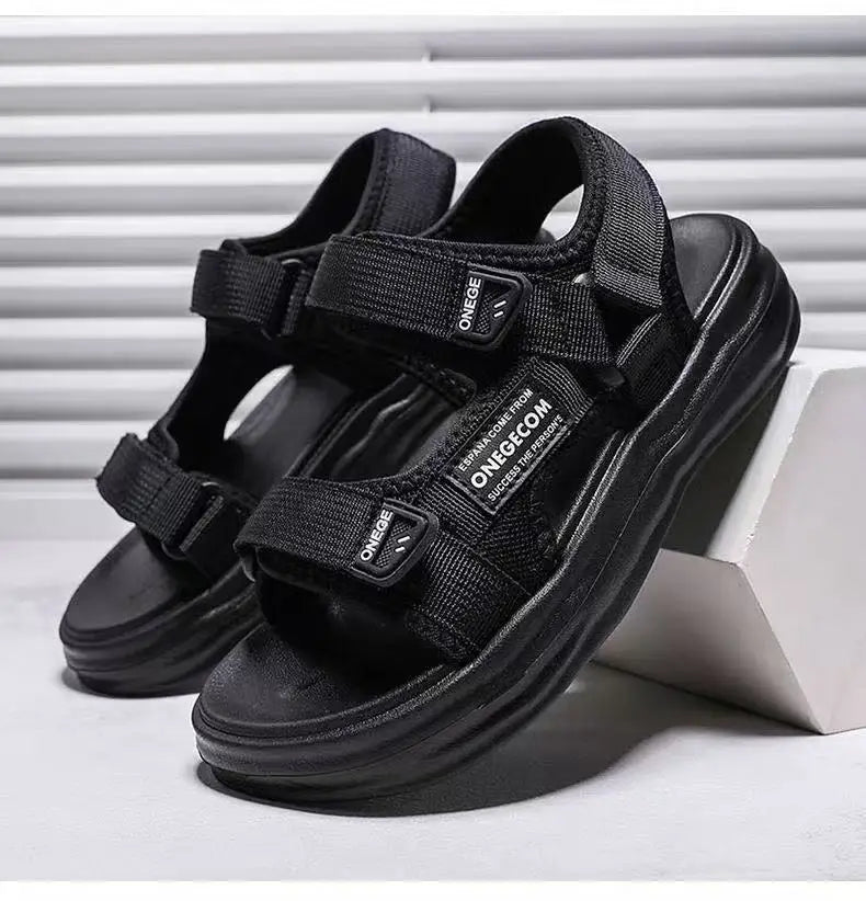 A pair of black Onegeg Boys' Non-Slip Summer Sport Sandals shown on a white surface.