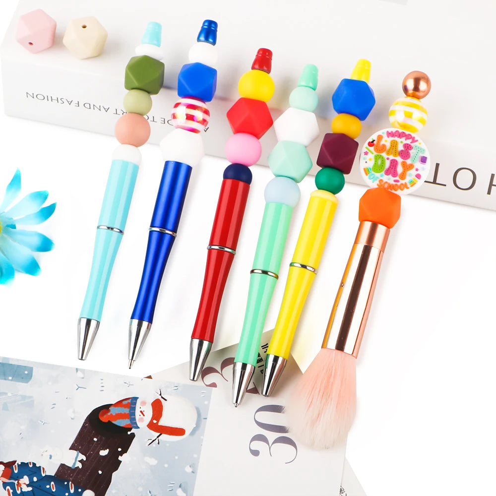 A set of 15 hexagonal silicone beads in various colors and a makeup brush displayed on a white background.