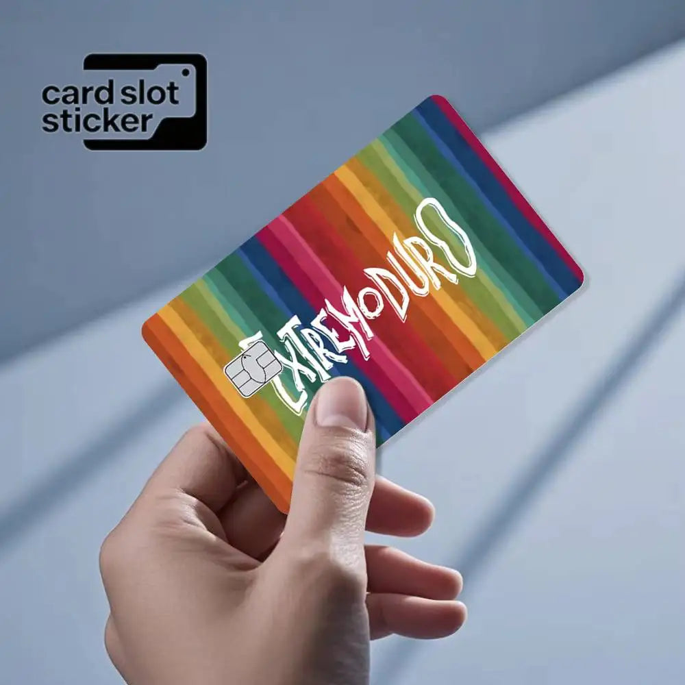 A hand holds a colorful card slot sticker featuring the text EXTREMODURO on a striped background.