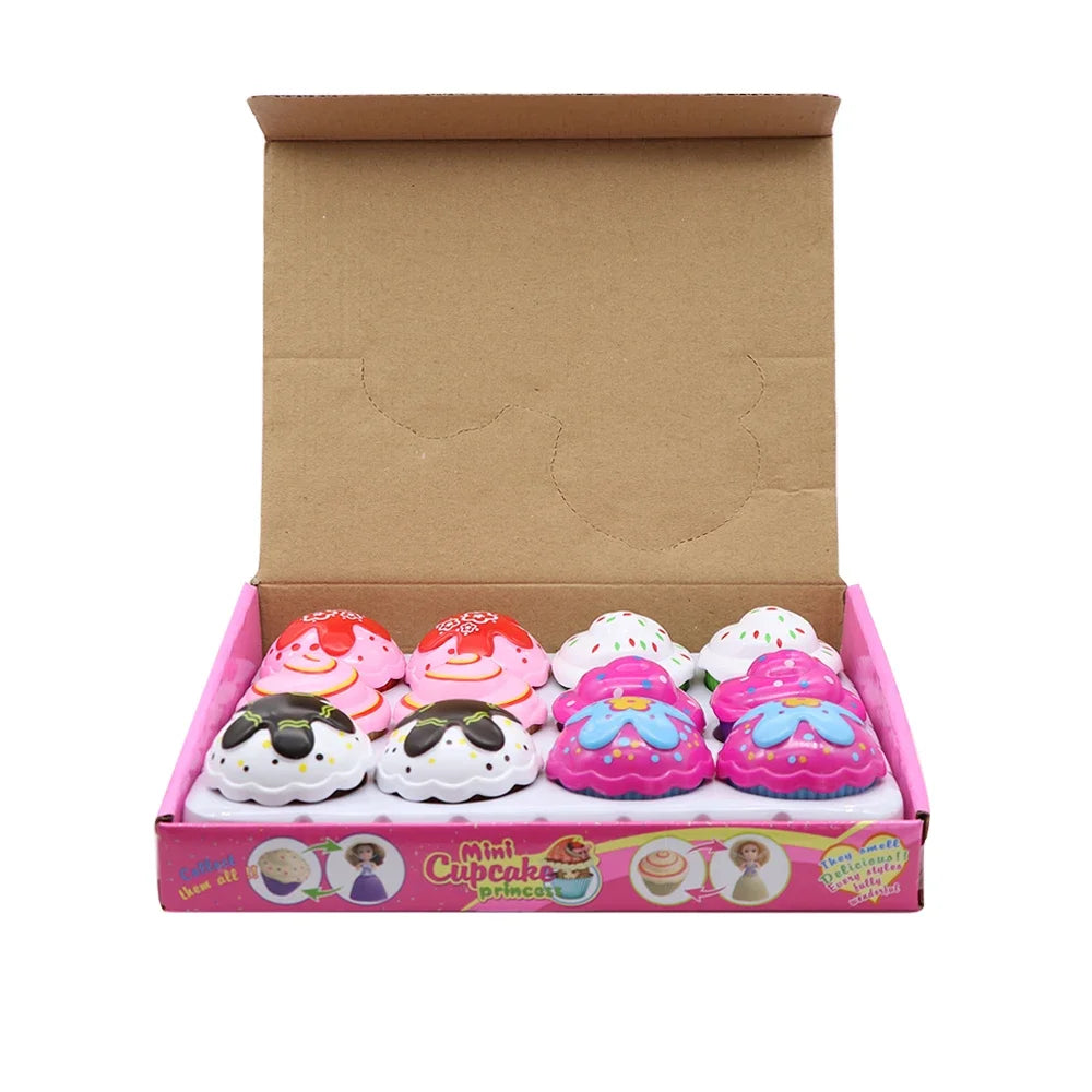 Box of Mini Cupcakes Princess Dolls featuring various pink and white themed cupcakes.