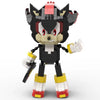 A black and gray stylized dinosaur figure built from building blocks with red accents.
