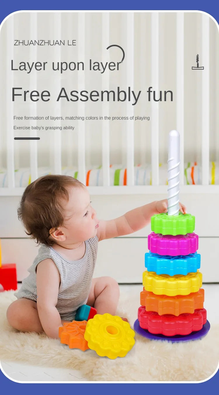 A baby is stacking colorful rings and a white tower toy for free assembly fun.