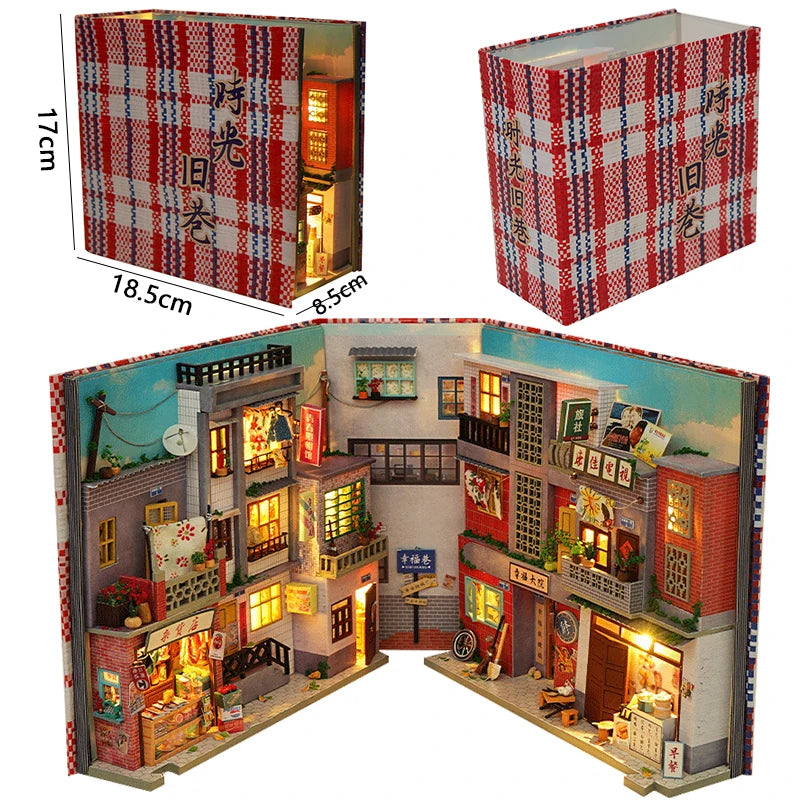 A DIY wooden book nook kit featuring a detailed miniature cityscape with illuminated windows and storefronts.