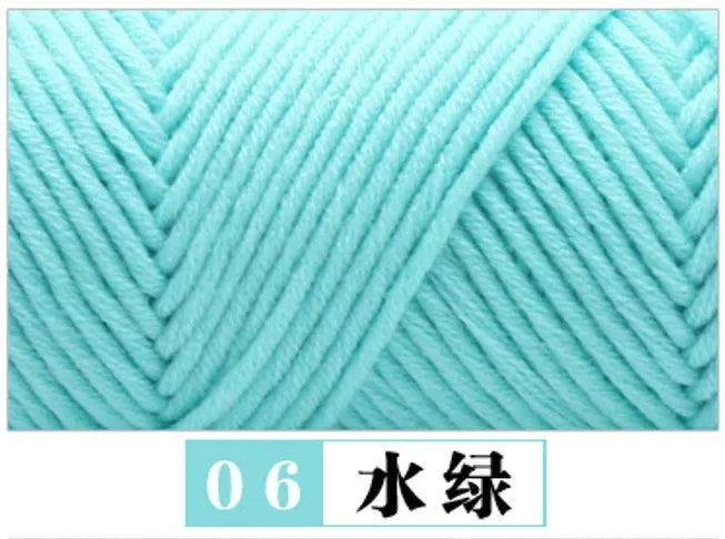 A close-up of a teal colored yarn, labeled as 06 Water Yarn, showing the twisted texture.