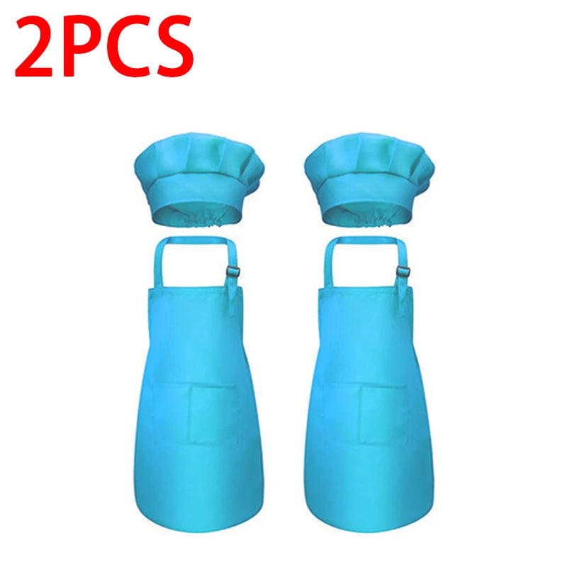 A pair of bright blue kids chef apron and hat set.