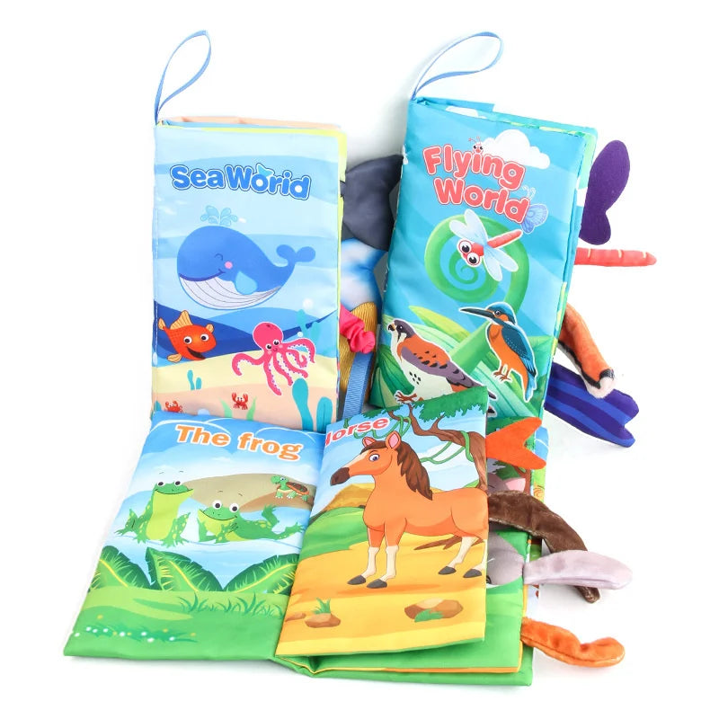 A colorful soft fabric baby book featuring sea creatures and a frog, with attached tails.