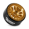 Injora Series beadlock wheels with a gold finish and black mounting, shown from above.