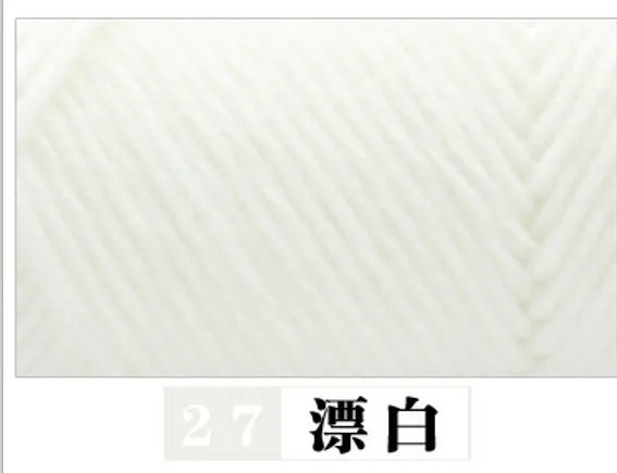 A close-up texture of white premium milk cotton yarn used for knitting.