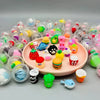 A collection of colorful transparent plastic eggshell party favors in various shades and shapes.