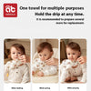 Three babies wearing soft cotton gauze burp cloths for feeding, eating, and playing.
