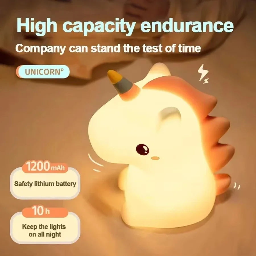 A cute white unicorn silicone LED night light illuminating a soft glow.