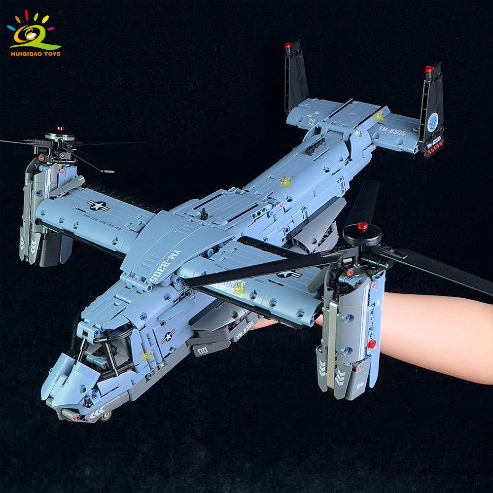 A detailed model of a V-22 Osprey military aircraft building block set in light blue and gray.