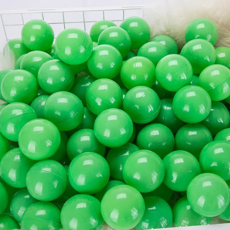 A pile of bright green plastic play balls for games and ball pits.