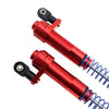 A close-up view of two red aluminum shock absorbers with black mounting components and blue coil springs.