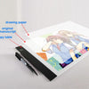 An LED drawing copy pad with writing paper, a manuscript, and a copy table are shown on a white surface.