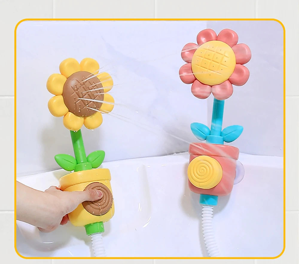 A hand is using a sunflower bath shower sprinkler toy for kids, which sprays water from a flower head.