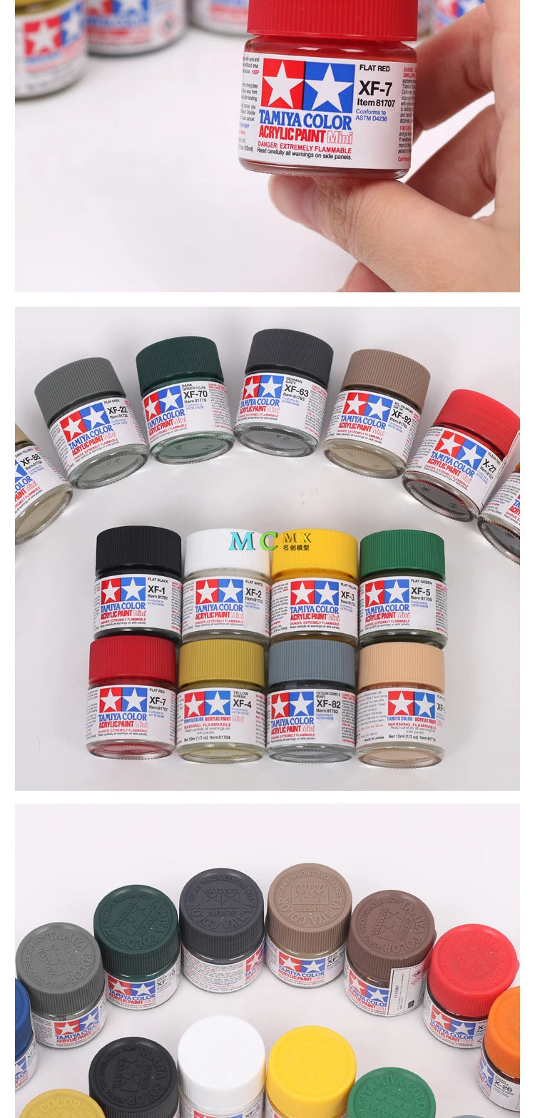 A collection of matte acrylic paint pots in various colors including red, yellow, green, and brown for model kits.