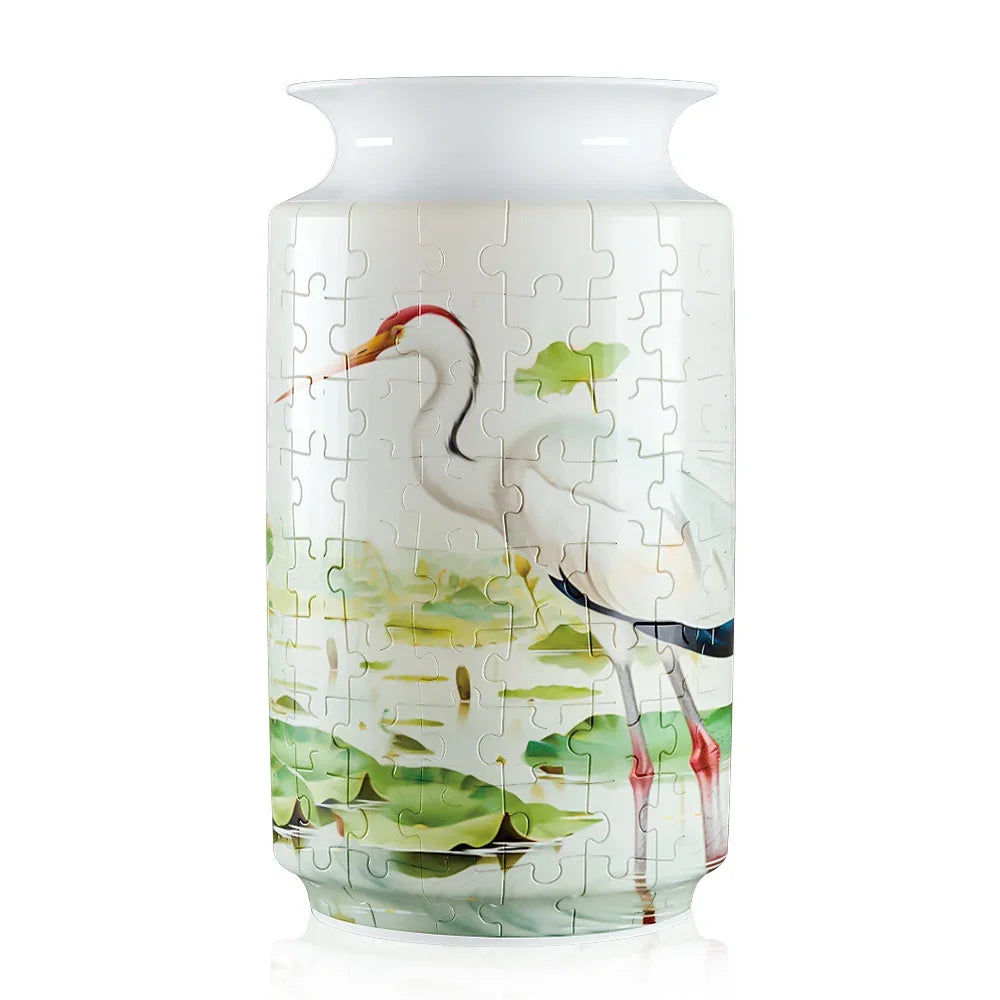 Blue and white porcelain 3D puzzle shaped like a flower vase featuring a white crane.