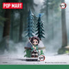 A collectible blind box figure of a Demon Slayer character in traditional attire standing in a snowy forest setting.