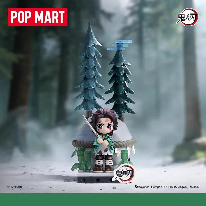 A collectible blind box figure of a Demon Slayer character in traditional attire standing in a snowy forest setting.