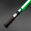 A premium metal lightsaber with a white blade and black grip is shown diagonally against a dark gray background.