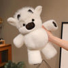 A hand is holding a white West Highland Calf plush toy with black markings, showing its soft texture.