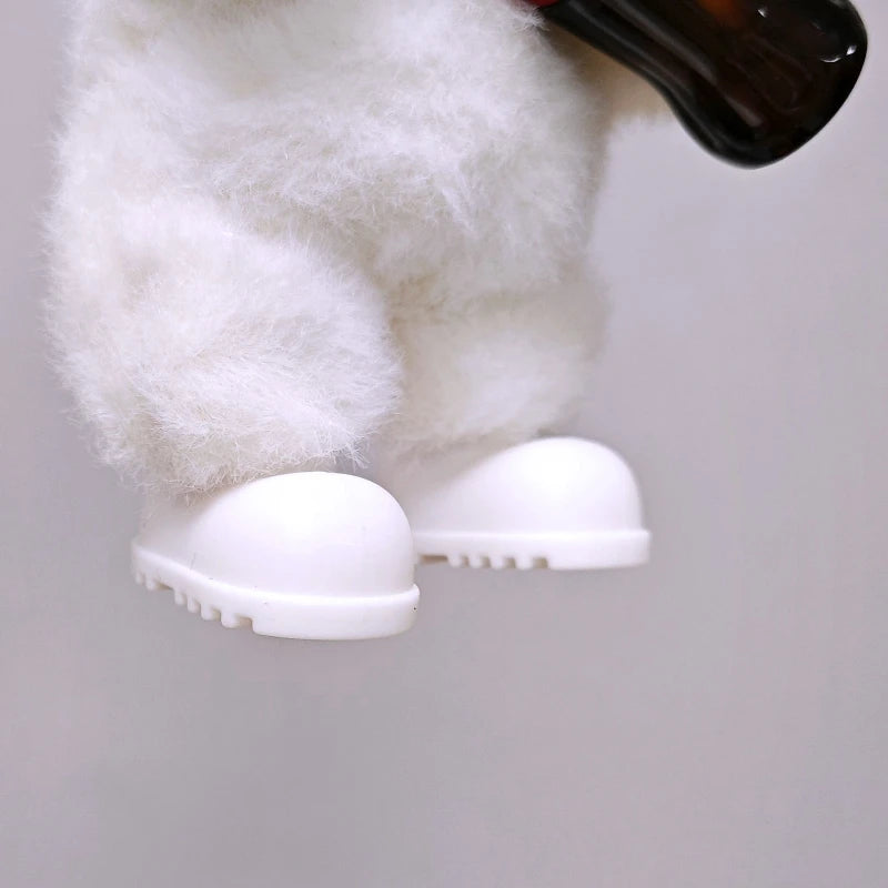 A white fluffy doll outfit featuring a white bear hoodie and white shoes, with a black object visible above.