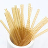 A set of transparent, flexible ring size adjusters with a textured surface are displayed in a white container.